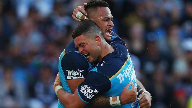 Phillip Sami of the Titans celebrates a try with team mate Ash Taylor. Photo: Getty Images