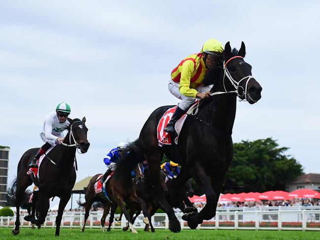 Amokura dashes clear to Group 1 Queensland Oaks victory under Damien Oliver for trainer Kris Lees. Picture: Grant Peters - Trackside Photography