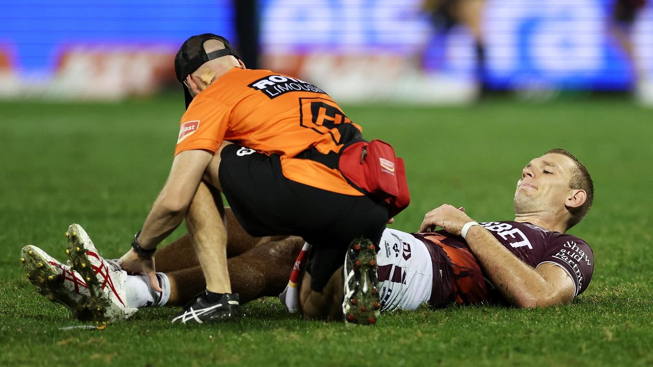 SYDNEY, AUSTRALIA - APRIL 23: Tom Trbojevic of the Sea Eagles receives attention from the trainer during the round eight NRL match between Wests Tigers and Manly Sea Eagles at Campbelltown Stadium on April 23, 2023 in Sydney, Australia. (Photo by Mark Kolbe/Getty Images)