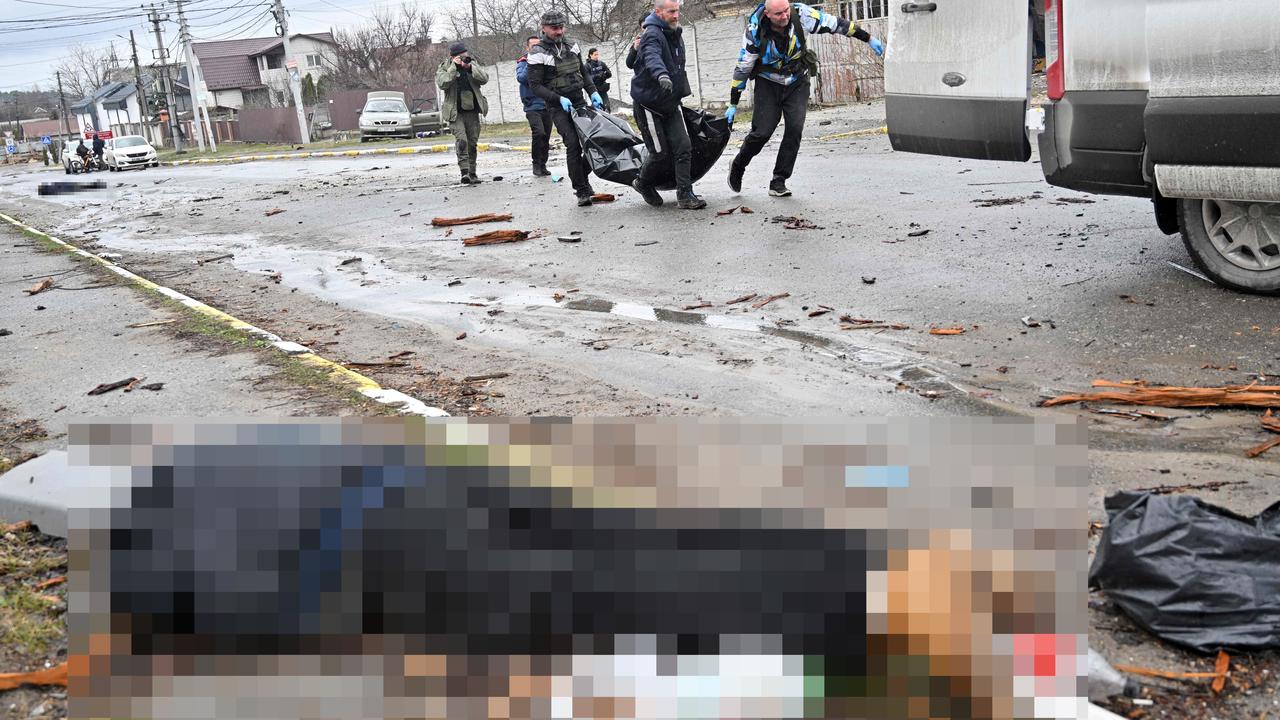 Dozens of bodies were found on the roadside. Ukraine has accused Russia of mining some of them. Picture: Sergei Supinsky/AFP