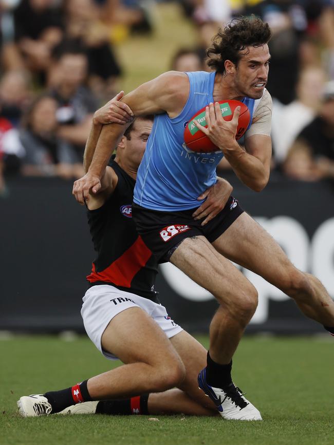 Max King of the Saints tries to break the tackle during the second quarter. Picture: Michael Klein