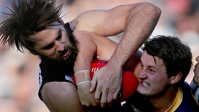 Port’s Justin Westhoff battles Adelaide’s Matt Crouch and Angus Monfries. Picture: Calum Robertson