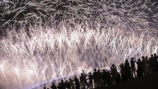 Revellers made the most of their ringside seats to the spectacular show. Picture: Getty Images