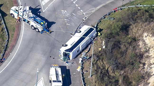 The bus carrying wedding guests rolled on its side. Picture: Christian Gilles/NCA NewsWire