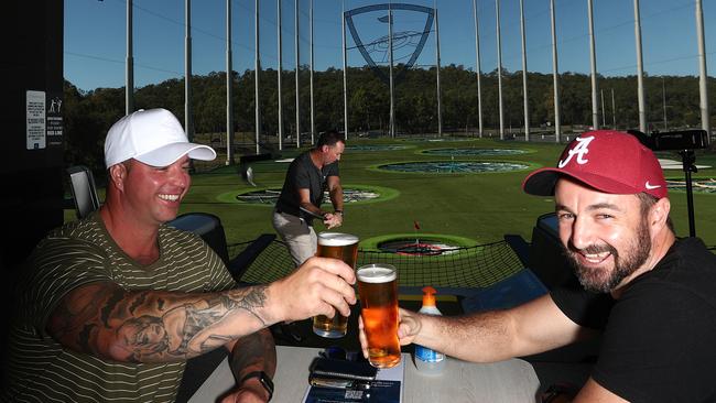 Plumbers Neil Young and Brett Stevenson are glad to be back on the green. Photograph: Jason O'Brien