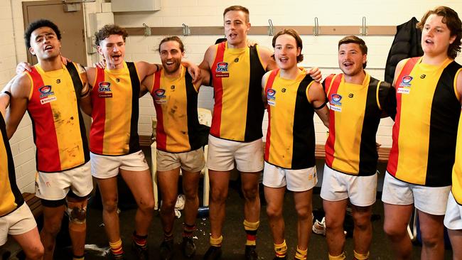 Cheltenham players sing the song in the rooms after winning a match last season. Photo by Josh Chadwick