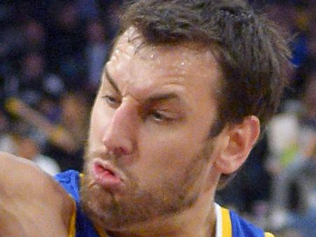 Los Angeles Lakers guard Kobe Bryant, center, puts up a shot as Golden State Warriors forward Draymond Green, left, and center Andrew Bogut, of Australia, defend during the second half of an NBA basketball game, Sunday, Nov. 16, 2014, in Los Angeles. The Warriors won 136-115. (AP Photo/Mark J. Terrill)