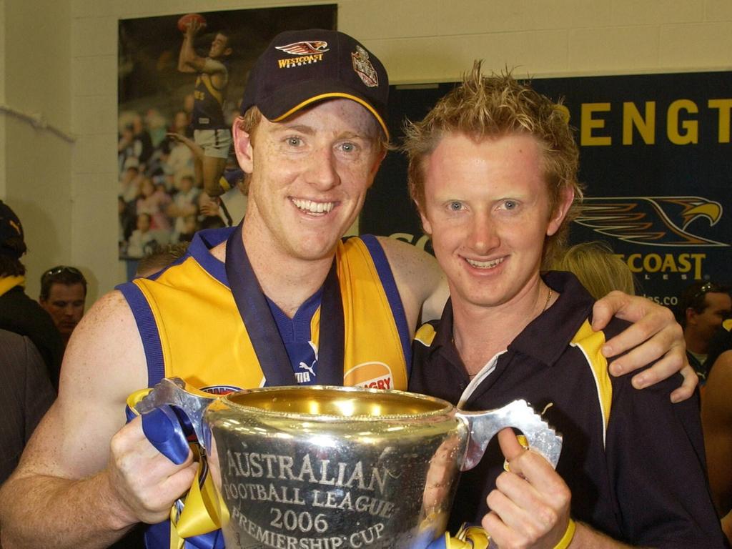 Hansen and his brother Chris with the 2006 premiership trophy.