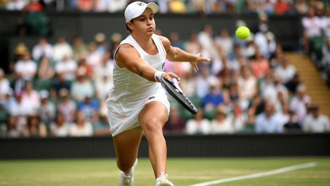 Ash Barty plays a forehand against Harriet Dart during their third round match at Wimbledon on Saturday. Picture: Getty images