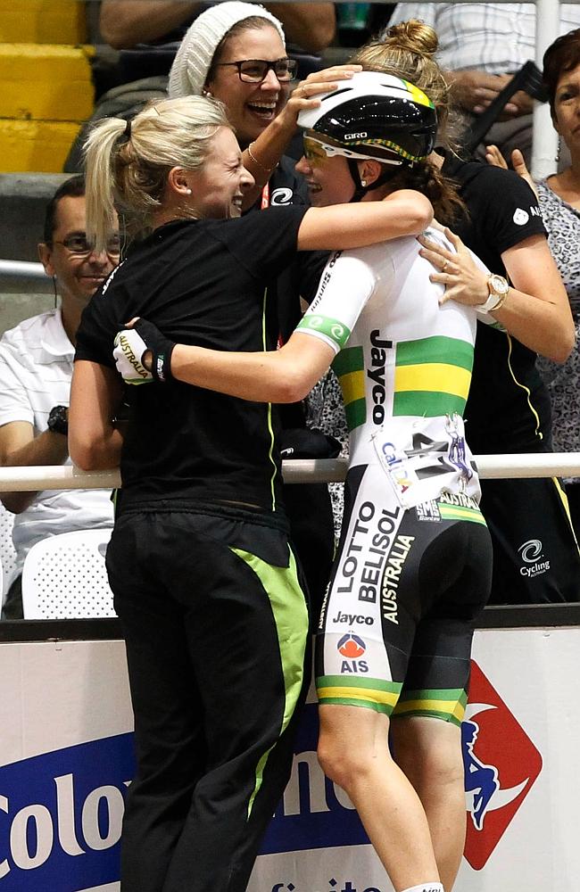 Cure celebrates with her overjoyed teammates at trackside.