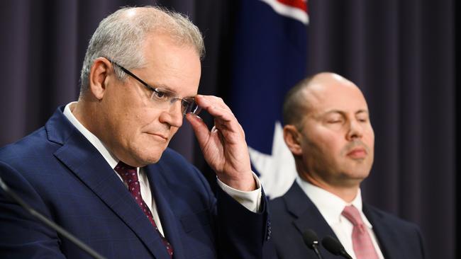 Scott Morrison and Treasurer Josh Frydenberg’s budget surplus may prove to become their “five minutes of economic sunshine”. Picture: Getty Images