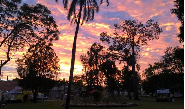 GLORIOUS: The sunrise captured over Memorial Park as the Growers Markets begin to to set up. Picture: Frances Klein