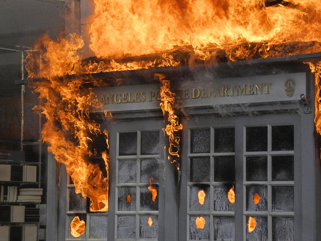 A Los Angeles Police Department kiosk is seen ablaze in The Grove shopping centre during a protest over the death of George Floyd. Picture: Mark J. Terrill/AP