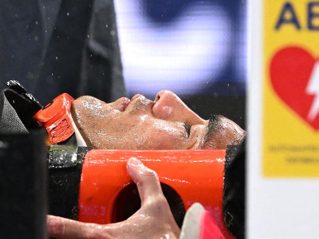 TOPSHOT - Waratahsâ Joseph-Aukuso Suaalii is stretchered off after an injury during the Super Rugby Pacific Round 13 match between the NSW Waratahs and Queensland Reds at the Allianz Stadium in Sydney on May 9, 2025. (Photo by Saeed Khan / AFP) / -- IMAGE RESTRICTED TO EDITORIAL USE - STRICTLY NO COMMERCIAL USE --