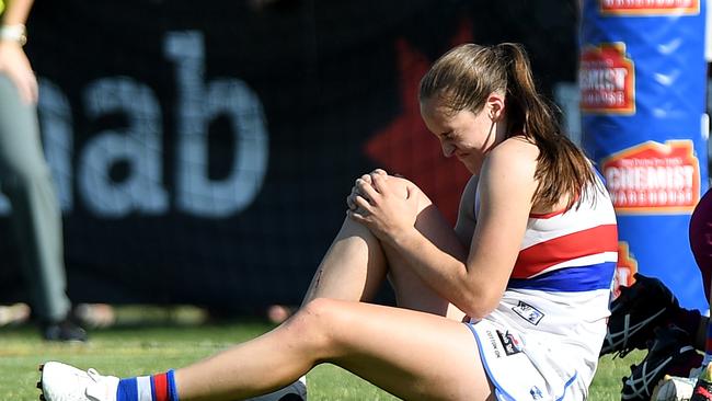 Isabel Huntington clutches her knee after rupturing her ACL in the second round of the 2018 AFLW season. Picture: Getty Images