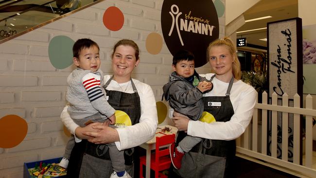 Nannies Jen Fear and Maryann Spaccavento care for Beijin Ge and Brendon Ruitteng while their parents shop. Picture: Daniel Munoz