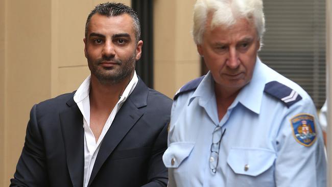 Mahmoud “Mick” Hawi leaving court in custody over the Sydney Airport bikie brawl in 2009. Picture: Bradley Hunter