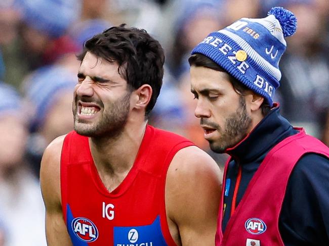 MELBOURNE, AUSTRALIA - JUNE 10: Christian Petracca of the Demons leaves the field injured during the 2024 AFL Round 13 match between the Collingwood Magpies and the Melbourne Demons at The Melbourne Cricket Ground on June 10, 2024 in Melbourne, Australia. (Photo by Dylan Burns/AFL Photos via Getty Images)