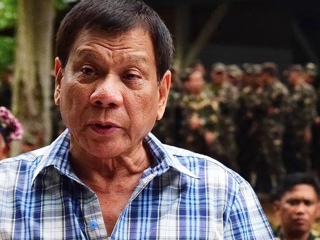 In this photograph received from the Presidential Photographers' Division on July 30, 2016, Philippine President Rodrigo Duterte speaks to members of the media during a visit to a military camp in Asuncion town, Davao del Norte province. Philippine president Rodrigo Duterte on July 30 withdrew a unilateral ceasefire with communist rebels after his ultimatum for the group to reciprocate lapsed.  RESTRICTED TO EDITORIAL USE - MANDATORY CREDIT 