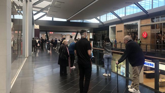 Apple had a long queue of customers waiting to enter the store.