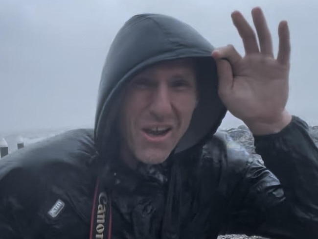 Reporter Peter Carruthers on the fringe of th category 2 storm Cyclone Jasper when it crossed the coast north of Port Douglas in 2023. Wind speeds reached between 154-177 km/h. Picture: Luke Williams