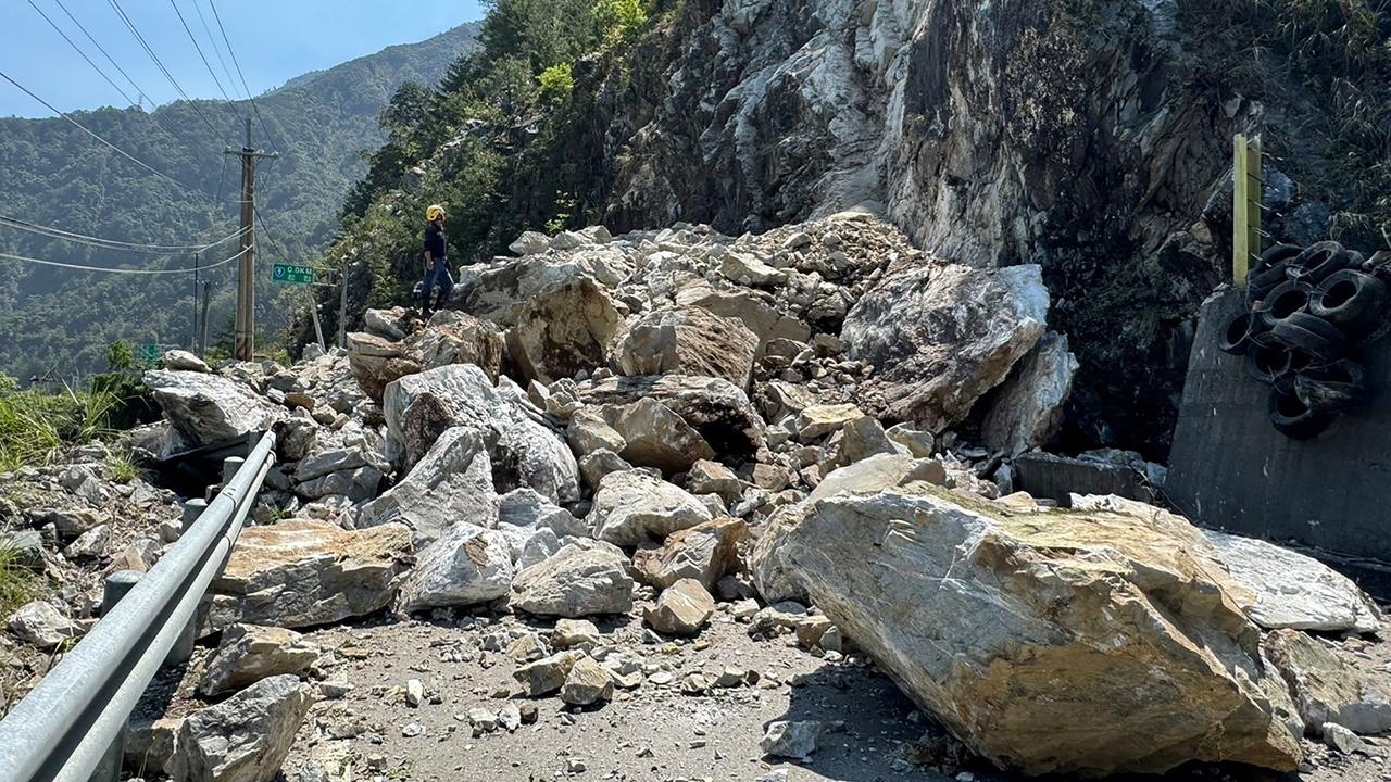 The earthquake caused these massive boulders to fall and block a section of highway. Picture: Handout/Taichung City Government's Fire Bureau/AFP