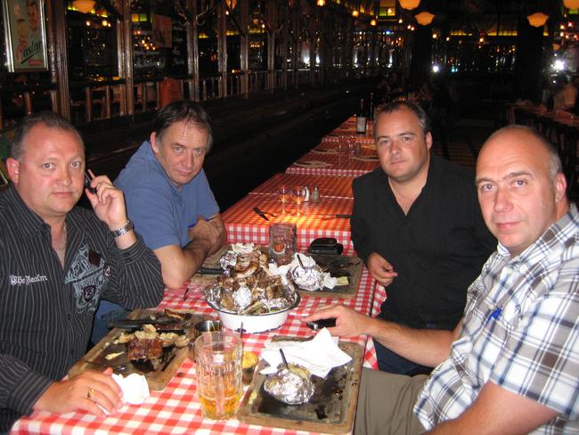 AFP agents Glen McEwen (on the phone) and Brett Thompson (third from left) having what had until then been a celebratory dinner with Dutch investigators, moments after they discovered Kinch had received a tip-off and escaped their dragnet. Picture: Supplied