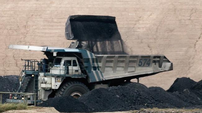 A coal truck is loaded at BHP Billiton's Mt Arthur coal mine in Muswellbrook, NSW. Picture: Ian Waldie/Getty Images