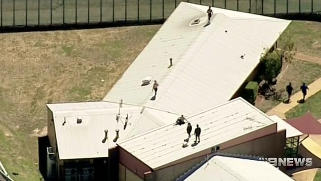 Images of people on the roof of Malmsbury Youth Justice Centre last January. Picture: Nine News Melbourne.