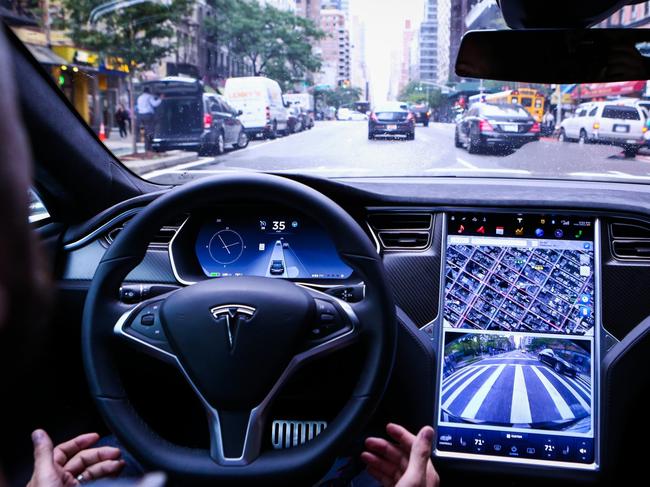 A driver rides in a Tesla Motors Inc. Model S vehicle equipped with Autopilot hardware and software. PHOTO: CHRISTOPHER GOODNEY/BLOOMBERG NEWS