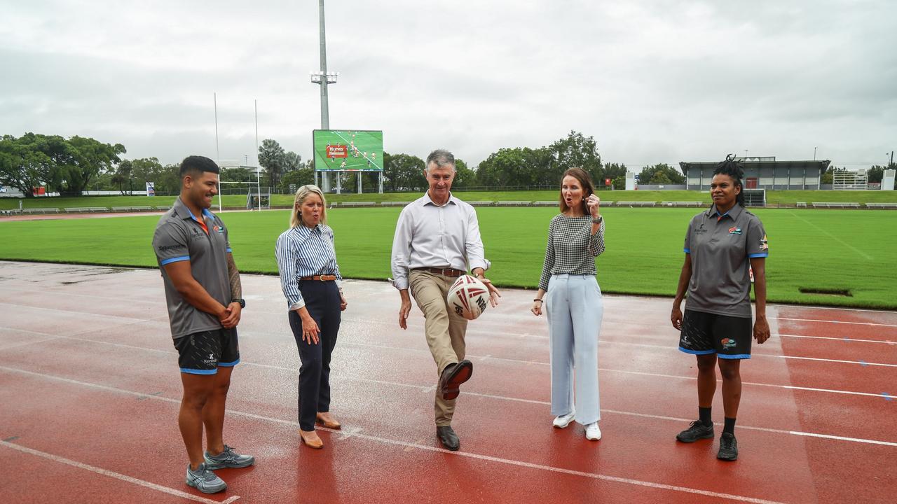 Northern Pride men's team outside back Quinnlan Tupou, Barron River MP Bree James, Minister for Sport Tim Mander, Cairns Mayor Amy Eden and Northern Pride women's team centre Stephanie Mooka celebrate the completion of audiovisual upgrades at Barlow Park.