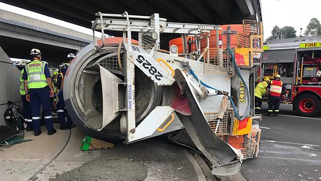 The truck ended up on it’s side and spilt concrete onto the footpath and road.