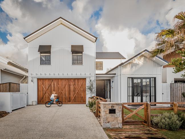 Custom made timber garage doors set the tone at the front of the house. Picture: Andy Macpherson