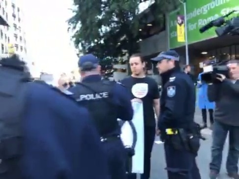 Climate change protesters confronted by police in Brisbane CBD