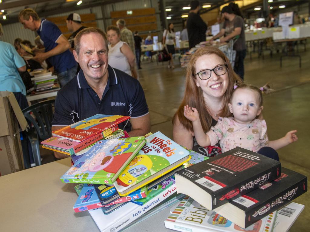 Grant Simpson, CEO Lifeline Darling Downs &amp; South West QLD serves Cassie and Lilli Naumann at The Chronicle Lifeline Bookfest 2022. Saturday, March 5, 2022. Picture: Nev Madsen.