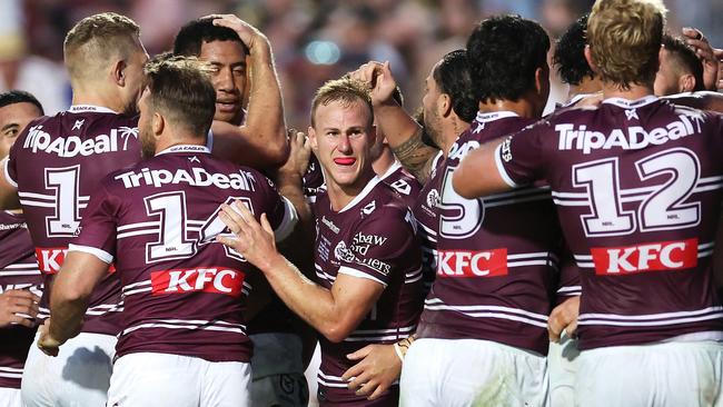 SYDNEY, AUSTRALIA - APRIL 06: DalyÃÂ Cherry-Evans (c) of the Sea Eagles celebrates with his team mates after a try during the round five NRL match between Manly Sea Eagles and Penrith Panthers at 4 Pines Park, on April 06, 2024, in Sydney, Australia. (Photo by Cameron Spencer/Getty Images)