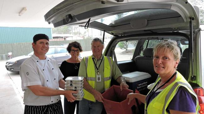 Meals on Wheels Maryborough is in desperate need of volunteer drivers like Dawn and Ken Hoare who also work in the kitchen with chef David Meier (left) and MOW co-ordinator Carly Partridge (2nd from left). Picture: Boni Holmes