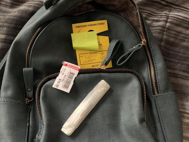 An old parking ticket and a white crystal were left behind in the second-hand bag. Picture: Facebook