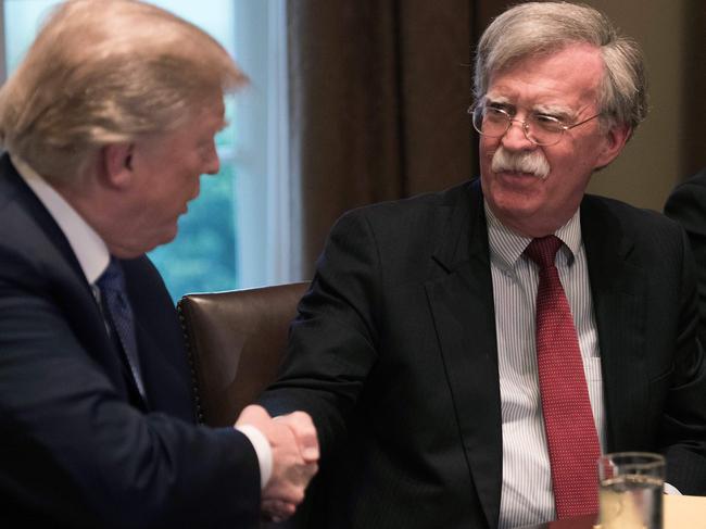 US President Donald Trump shakes hands with National Security Adviser John Bolton. Picture: AFP