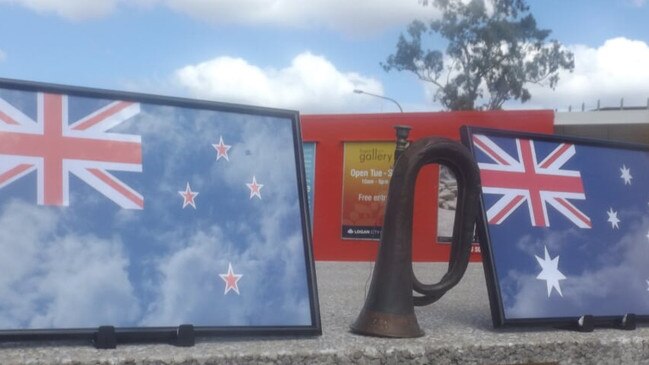 Mic Noble’s tribute at the Logan war memorial, where the service was cancelled but he organised a video tribute. (AAP/Image Sarah Marshall)