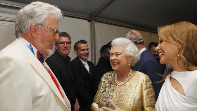 Harris with Queen Elizabeth II and Kylie Minogue in 2012. Picture: Getty Images.