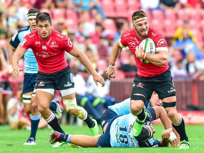 Waratahs player David Lolohea falls off a tackle.