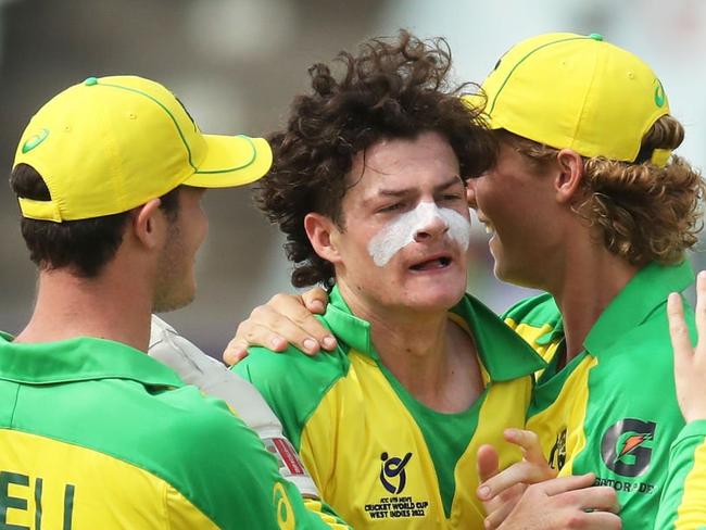 GEORGETOWN, GUYANA - JANUARY 14: Will Salzmann of Australia celebrates the wicket of Shaqkere Parris of West Indies with team mates Tobias Snell and Corey Miller during the ICC U19 Men's Cricket World Cup match between West Indies and Australia at Providence Stadium on January 14, 2022 in Georgetown, Guyana. (Photo by Ashley Allen-ICC/ICC via Getty Images)