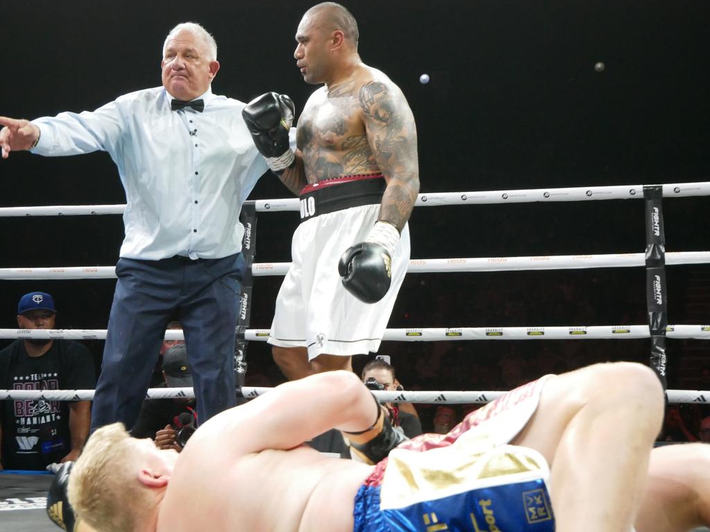 Ben Hannant is knocked to the ground by Junior Paulo at the Battle of the Reef fight night at the Townsville Entertainment and Convention centre, October 7 2023. Picture: Blair Jackson.