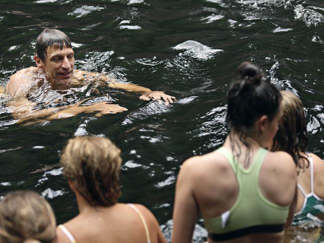 Adelaide Crows coach Matthew Clarke swimming with the team at Florence Falls in Litchfield National Park in January, 2019 when the team was in the Northern Territory for its pre-season camp. 