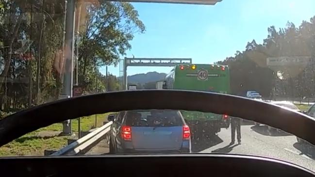 Fire and Rescue NSW Banora Point captured a video of one of the station's firefighters trying to dodge wayward drivers on the M1 at Chinderah. Picture: Fire and Rescue NSW Banora Point