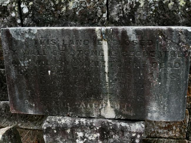 Robert Henderson bequeathed the cemetery to the dead who lay within its walls and left this engraved stone plaque as a reminder. Picture: AAP Image