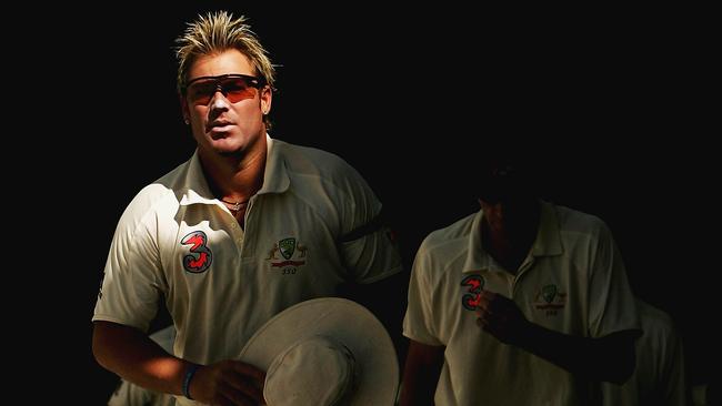 Shane Warne walks onto the field during day three of the Second Test between Australia and South Africa at the MCG. Picture: Getty Images