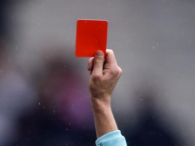 Atletico Madrid's Spanish forward Diego Costa receives a red card after celebrating a goal with supporters during the Spanish league football match Club Atletico de Madrid vs Getafe CF at the Wanda Metropolitano stadium in Madrid on January 6, 2018. / AFP PHOTO / OSCAR DEL POZO