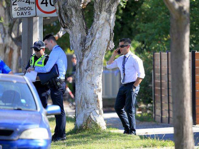 Detectives at the scene where a child has been found in a car. Picture: Mark Stewart